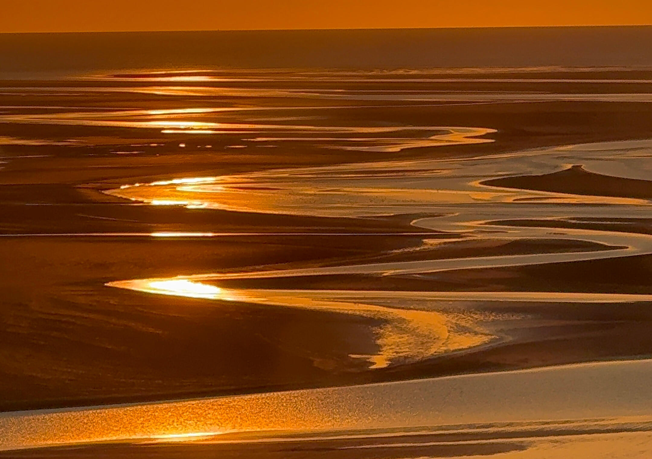 Coucher de soleil sur la Baie du Mont Saint-Michel Vue depuis l’Abbaye du Mont Saint-Michel